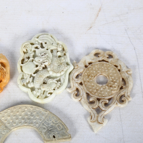 119 - A group of 4 Chinese jade pendants, including a monkey and horse design, and a crescent-shaped tiger