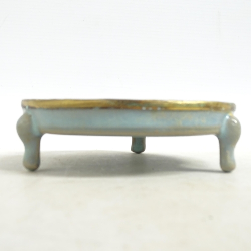 103 - A Chinese turquoise  brush washer on 3 feet, with applied brass edge