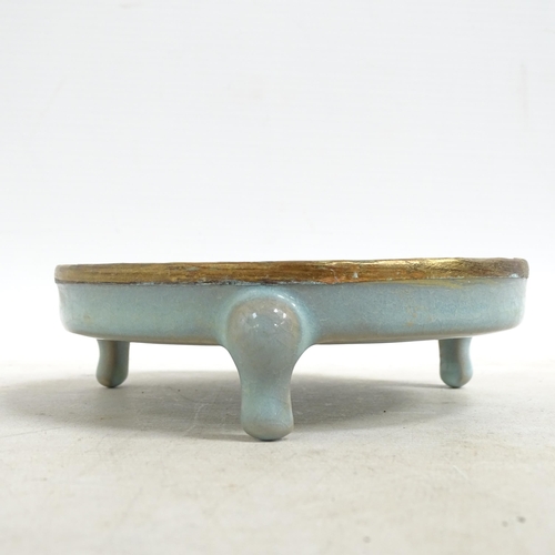 103 - A Chinese turquoise  brush washer on 3 feet, with applied brass edge