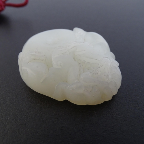 108 - 4 various Chinese carved jade pendants, all with carved and relief decoration, tallest 7cm