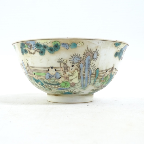 186 - A Chinese famille verte bowl on foot, with painted village figure decoration, and a blue six charact... 