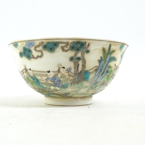 186 - A Chinese famille verte bowl on foot, with painted village figure decoration, and a blue six charact... 