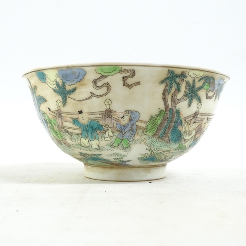 186 - A Chinese famille verte bowl on foot, with painted village figure decoration, and a blue six charact... 