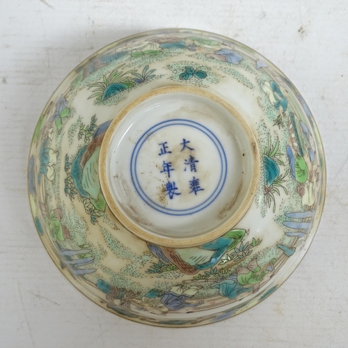 186 - A Chinese famille verte bowl on foot, with painted village figure decoration, and a blue six charact... 