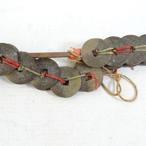 188 - A pair of Chinese coin swords, L46cm