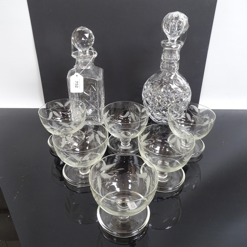 752 - A set of 6 etched glass Sundae dishes and 2 cut glass decanters.