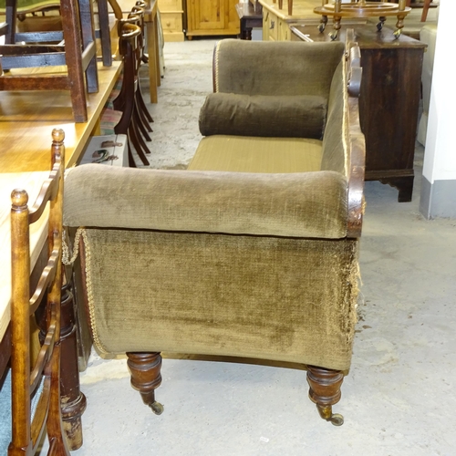 2538 - A Regency mahogany and upholstered rollover arm three-seater settee, raised on turned legs with bras... 