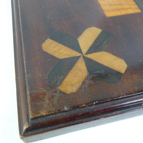 156 - A 19th century parquetry inlaid mahogany games board, 46cm x 46cm