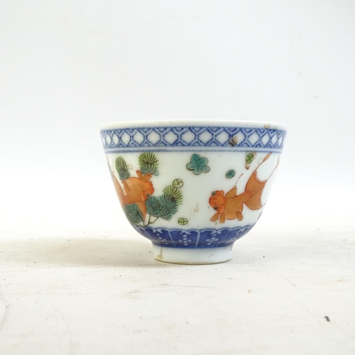 164 - A Chinese blue and white tea bowl, and a blue and white tea bowl with red fish decorated border, and... 