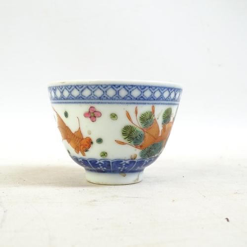 164 - A Chinese blue and white tea bowl, and a blue and white tea bowl with red fish decorated border, and... 