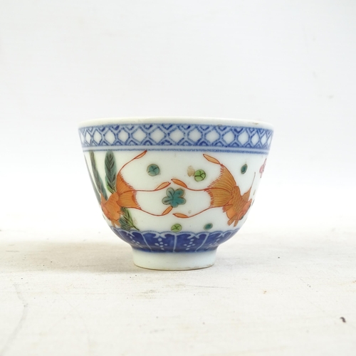 164 - A Chinese blue and white tea bowl, and a blue and white tea bowl with red fish decorated border, and... 