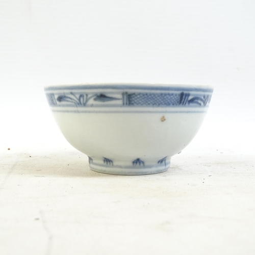 164 - A Chinese blue and white tea bowl, and a blue and white tea bowl with red fish decorated border, and... 