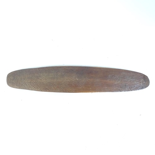 63 - An Australian Aboriginal chip carved shield, length 55cm