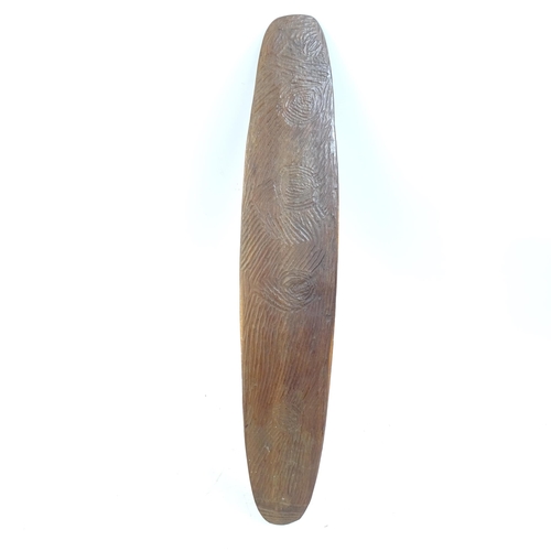 63 - An Australian Aboriginal chip carved shield, length 55cm