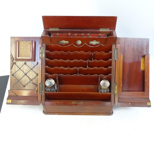 697 - A Victorian mahogany stationery cabinet, interior has scalloped-shaped dividers with pen tray and 2 ... 