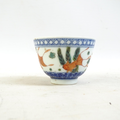 164 - A Chinese blue and white tea bowl, and a blue and white tea bowl with red fish decorated border, and... 