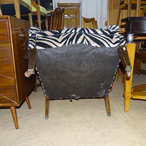 2177 - A Victorian wingback armchair with Zebra style upholstery.