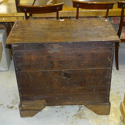 2539 - A Georgian oak kneehole writing desk, with seven drawers and cupboard, raised on bracket feet. 92x80... 