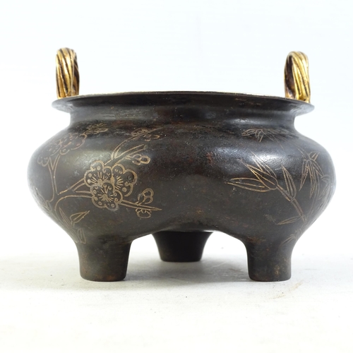 101 - A Chinese bronze 2-handled censer, with gilded bamboo and blossom decoration, on 3 feet, width 12cm,... 