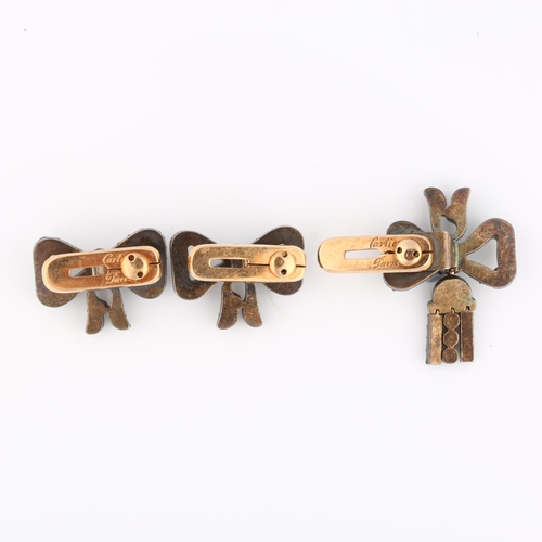 1105 - CARTIER - a set of 3 Art Deco diamond ribbon bow dress studs, 1 having en tremblant drop, set with r... 