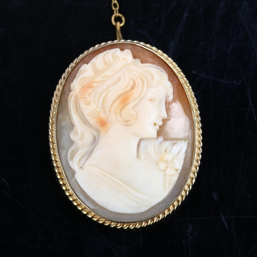 1184 - A Vintage shell cameo brooch, depicting female profile in 9ct frame, brooch height 37.9mm, 8.9g