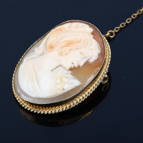 1184 - A Vintage shell cameo brooch, depicting female profile in 9ct frame, brooch height 37.9mm, 8.9g