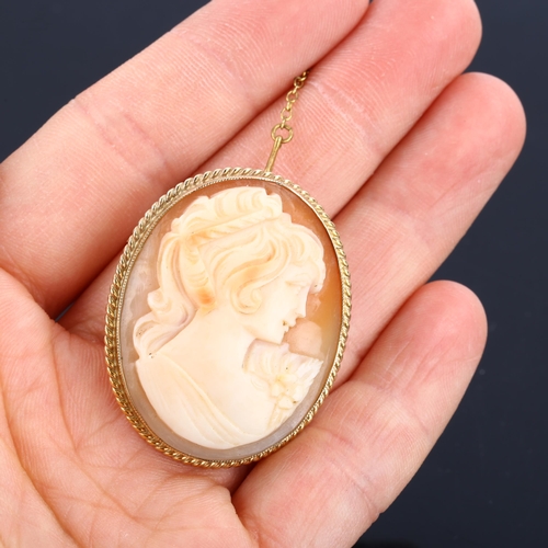 1184 - A Vintage shell cameo brooch, depicting female profile in 9ct frame, brooch height 37.9mm, 8.9g