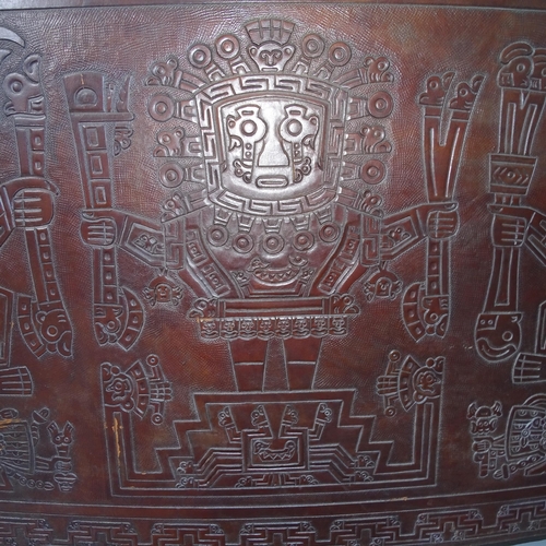 2020 - A mid-century Peruvian tooled leather clad bar, with embossed Aztec design. 143x109x61cm