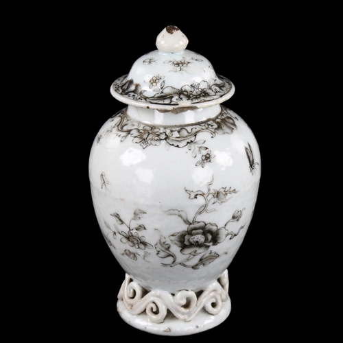 19 - An Antique Chinese porcelain tea jar, with scrollwork base and black and gilded decoration, height 1... 