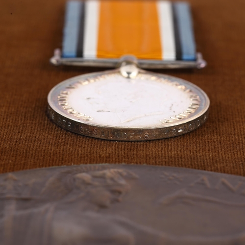 28 - A framed collection of First War medals and memorial plaque to Carey Saunders Private 12th London Re... 