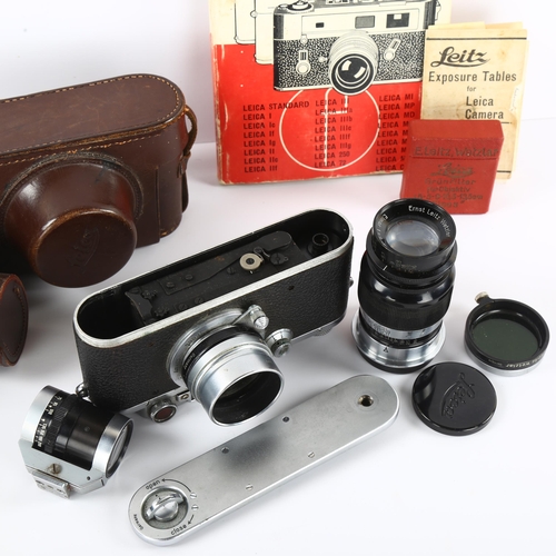 4 - A 1936 Leica IIIa camera, serial No 188801,  a TEWE variable viewfinder, A Leica telephoto lens seri... 