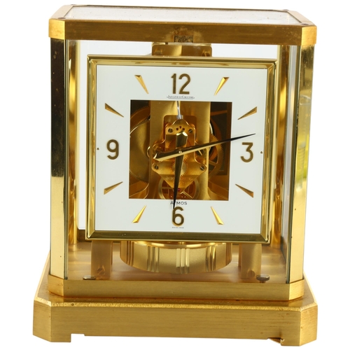 103 - JAEGER LECOULTRE - a gilt-brass Atmos clock, square white lacquered dial with quarterly Arabic numer... 