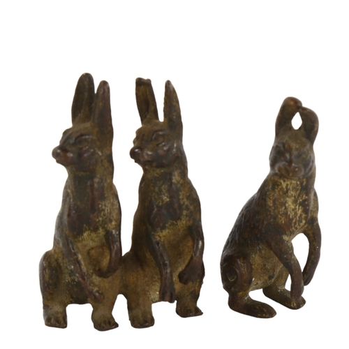 110 - 3 miniature cold painted bronze hares in 2 groups, height 4.5cm