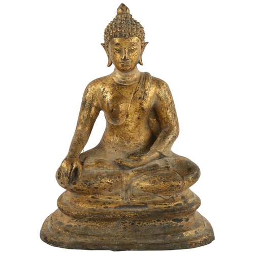 115 - A gilded cast-metal figure of a Buddha, height 23cm