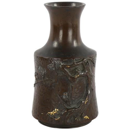 116 - A Japanese bronze vase with relief tree and gilt decoration in mallet form, height 15cm