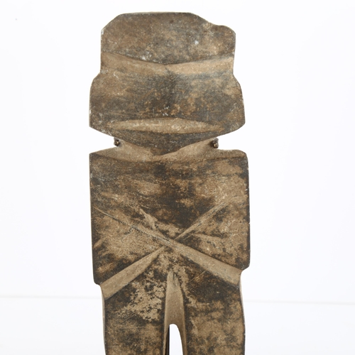 120 - A pre-Columbian hardstone carved figure on mounted wood and metal stand, height of figure 13cm