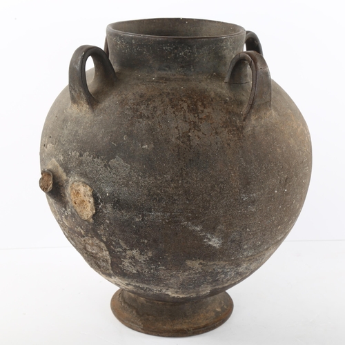 122 - A North African lugged vessel on footed base, height 30cm