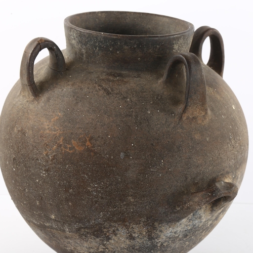 122 - A North African lugged vessel on footed base, height 30cm