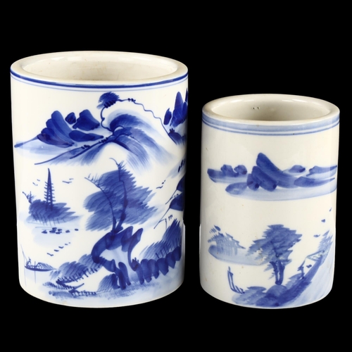 140 - 2 Chinese blue and white decorated brush pots, tallest 16cm