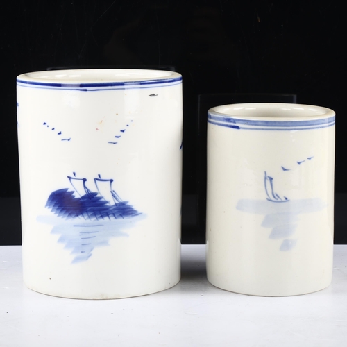 140 - 2 Chinese blue and white decorated brush pots, tallest 16cm