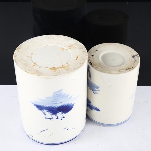 140 - 2 Chinese blue and white decorated brush pots, tallest 16cm