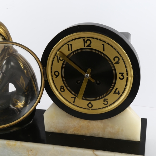 60 - An Art Deco clock on marble base with bronzed and gilded metal figure, length 50cm