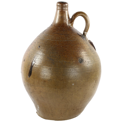 66 - A large 18th Century salt glaze Bellarmine jug, height 44cm