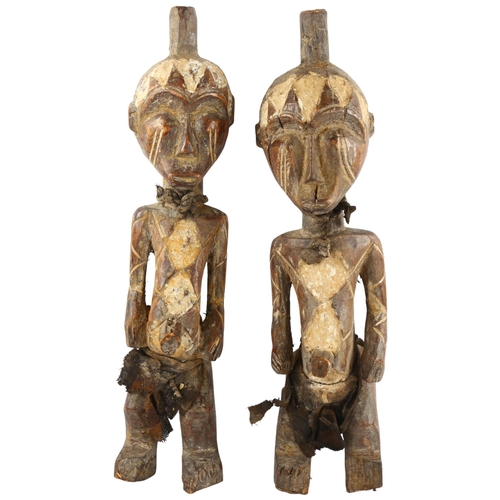 67 - A pair of West African carved wood figures, tallest 44cm