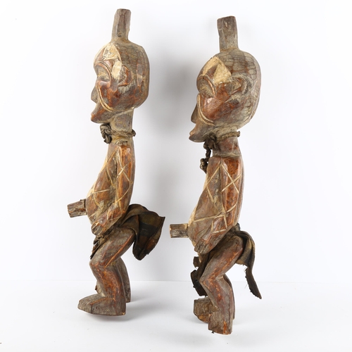 67 - A pair of West African carved wood figures, tallest 44cm