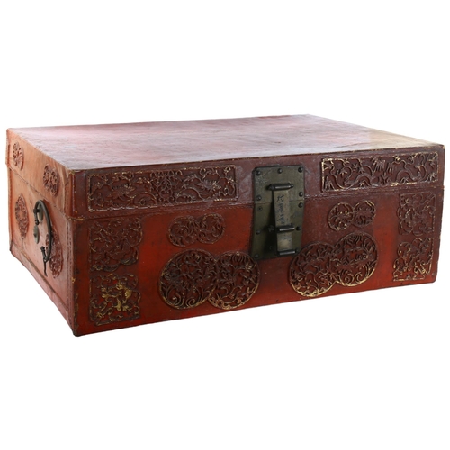 79 - An early 20th century suitcase, with red lacquer finish and applied chinoiserie decoration, dimensio... 