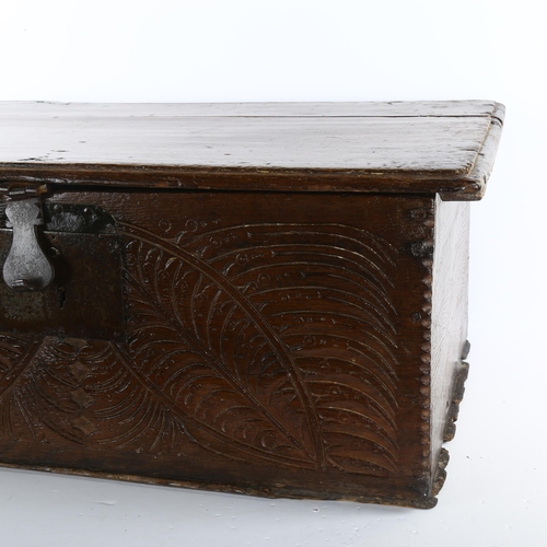 82 - An early 17th century Bible box, incised with wheatsheaf carving, 69 x 52cm, height 29cm