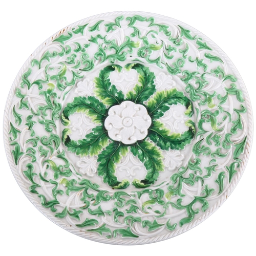 83 - A 19th century Meissen porcelain plate with relief decoration, diameter 27cm