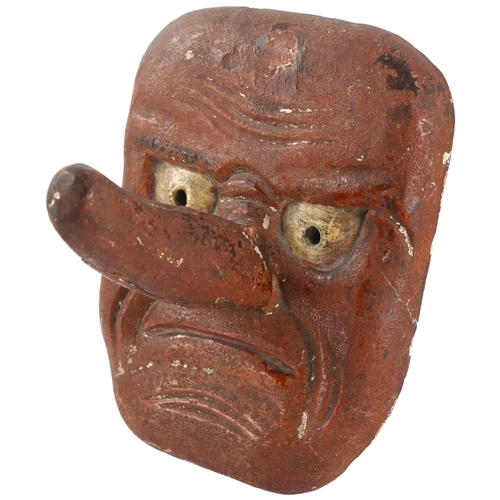 96 - An Antique Japanese wood carved Noh wall mask of Tengu with articulated nose, length 19cm