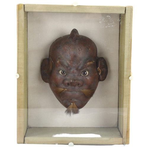 97 - A carved and lacquered Japanese mask in glazed case, case length 25 x 21cm